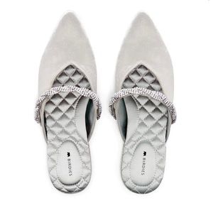 The Swan Snow Crystal Bracelet pointed-toe slides.